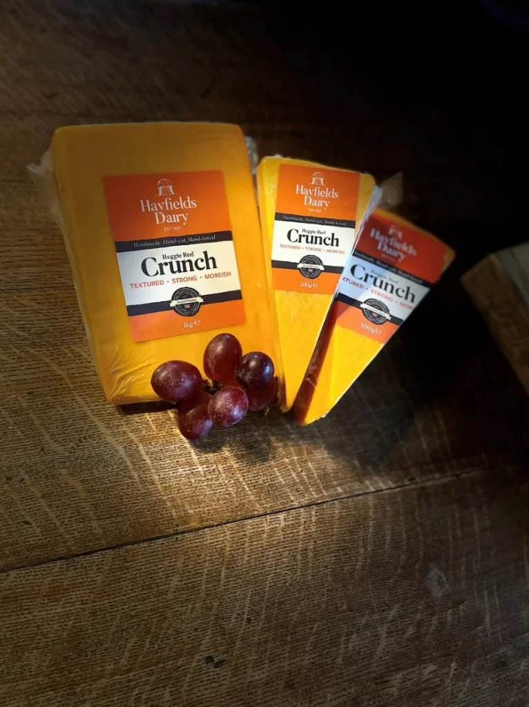 Hayfields Crunch cheese in 1kg, 500g and 200g packs with red grapes